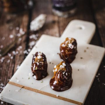chocolate stuffed dates on cutting board