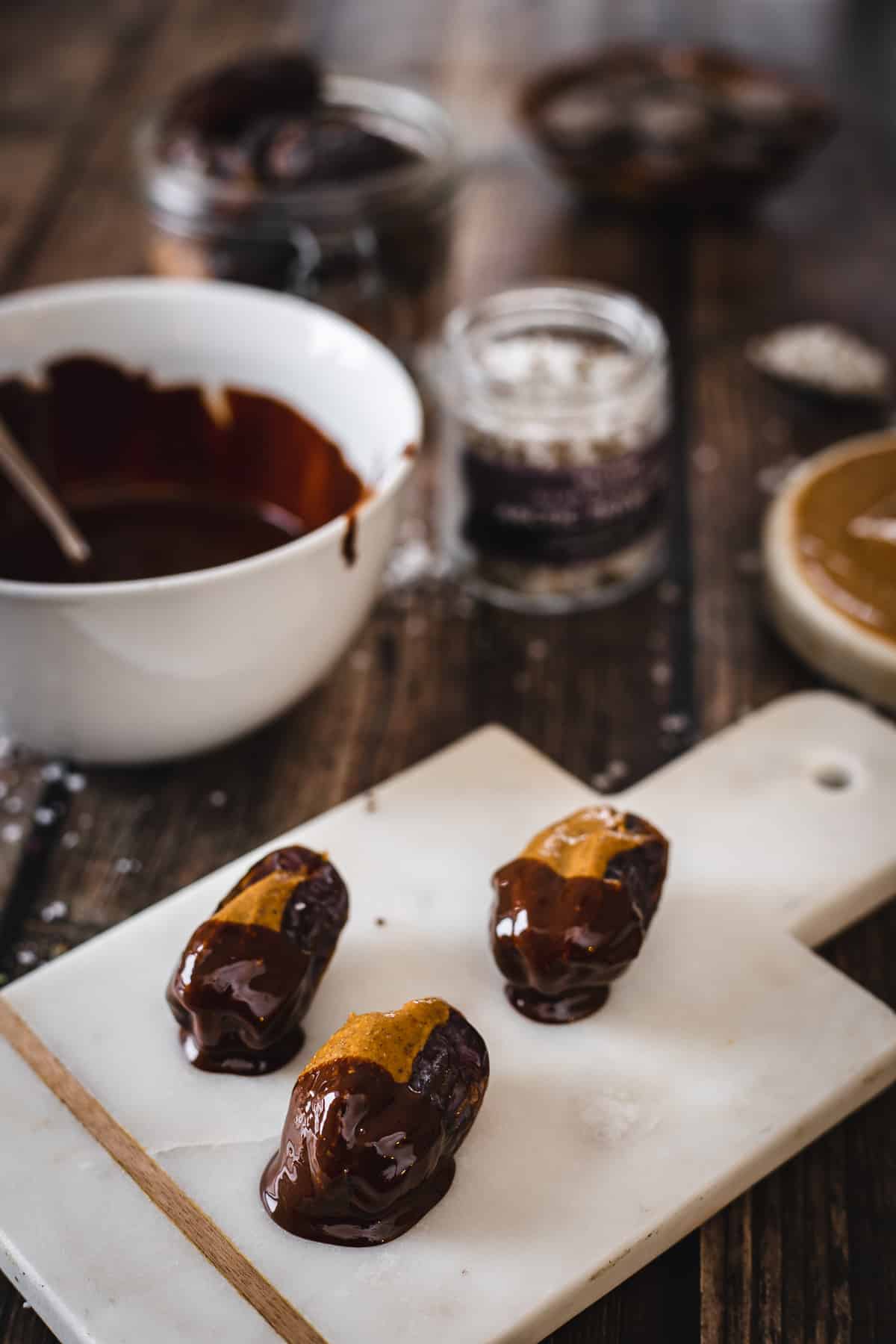 dates stuffed with almond butter dipped in chocolate