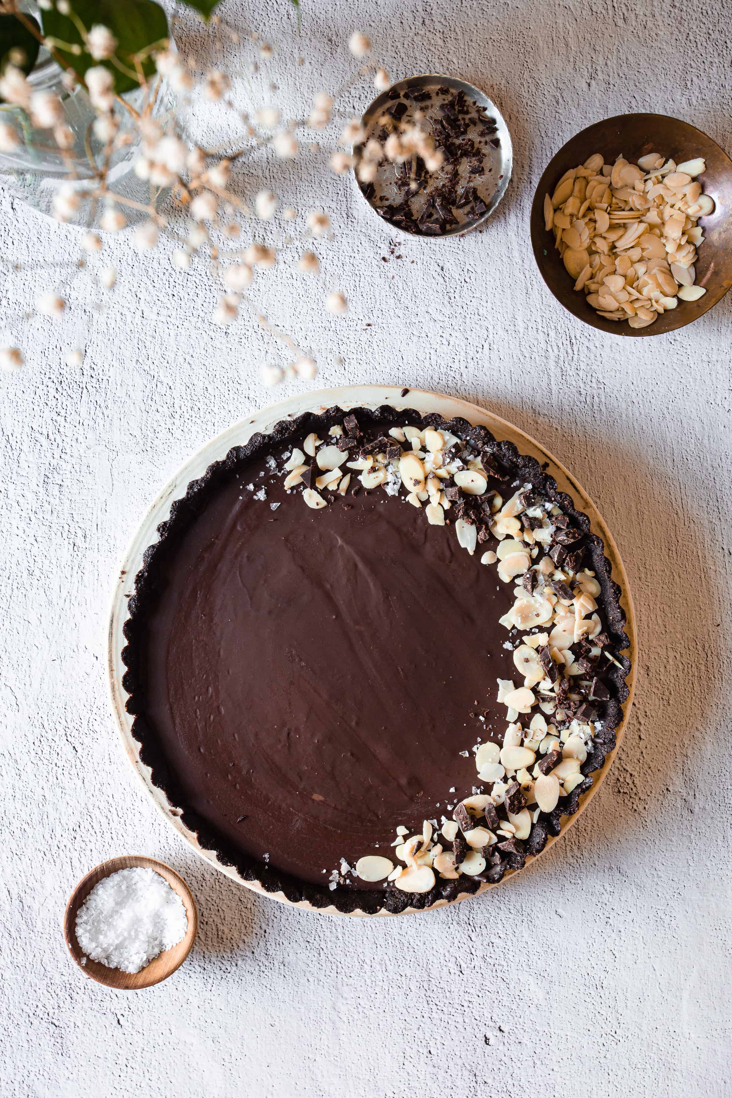 chocolate tart, almonds, chocolate chips and salt