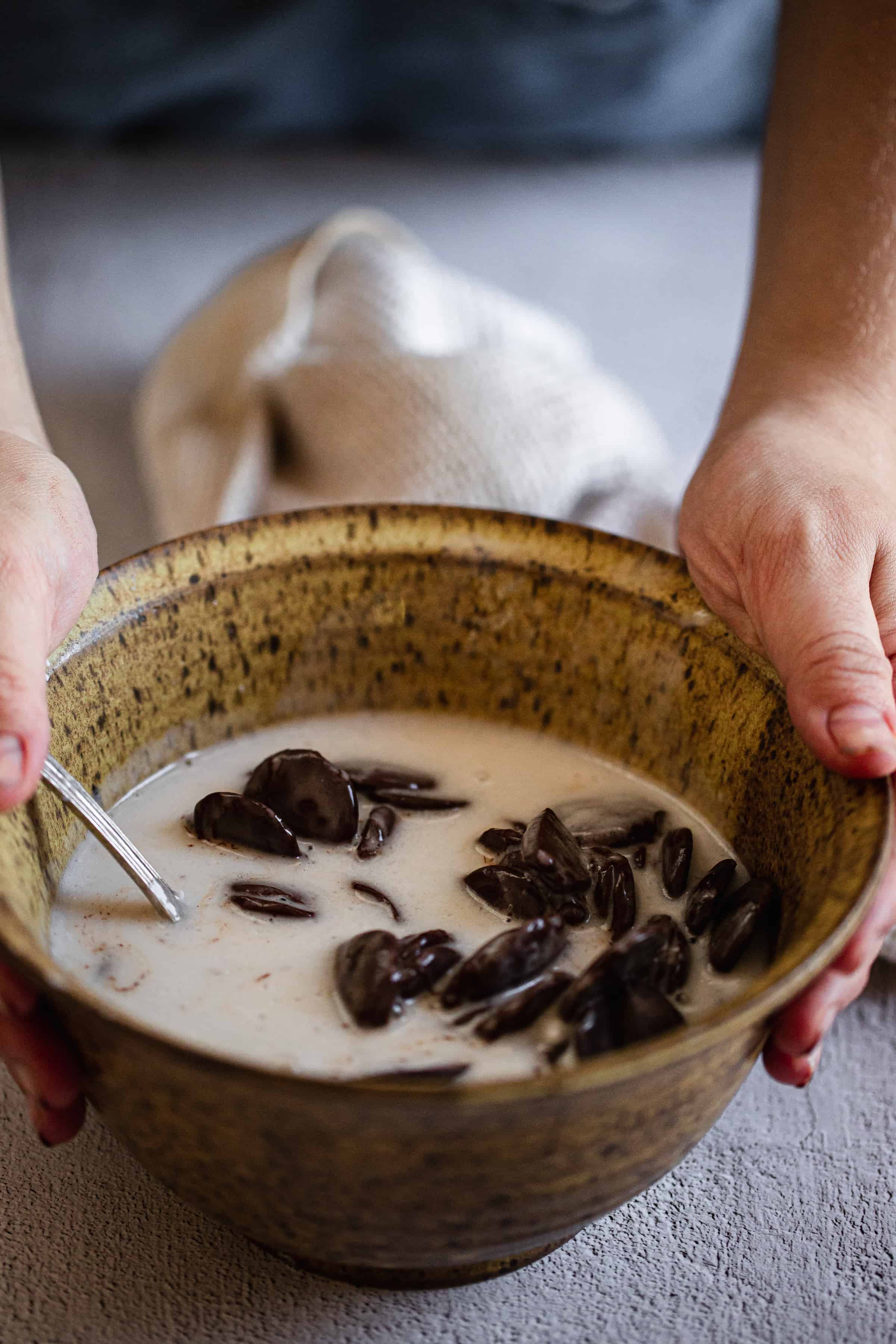 stirring coconut milk into chocolate