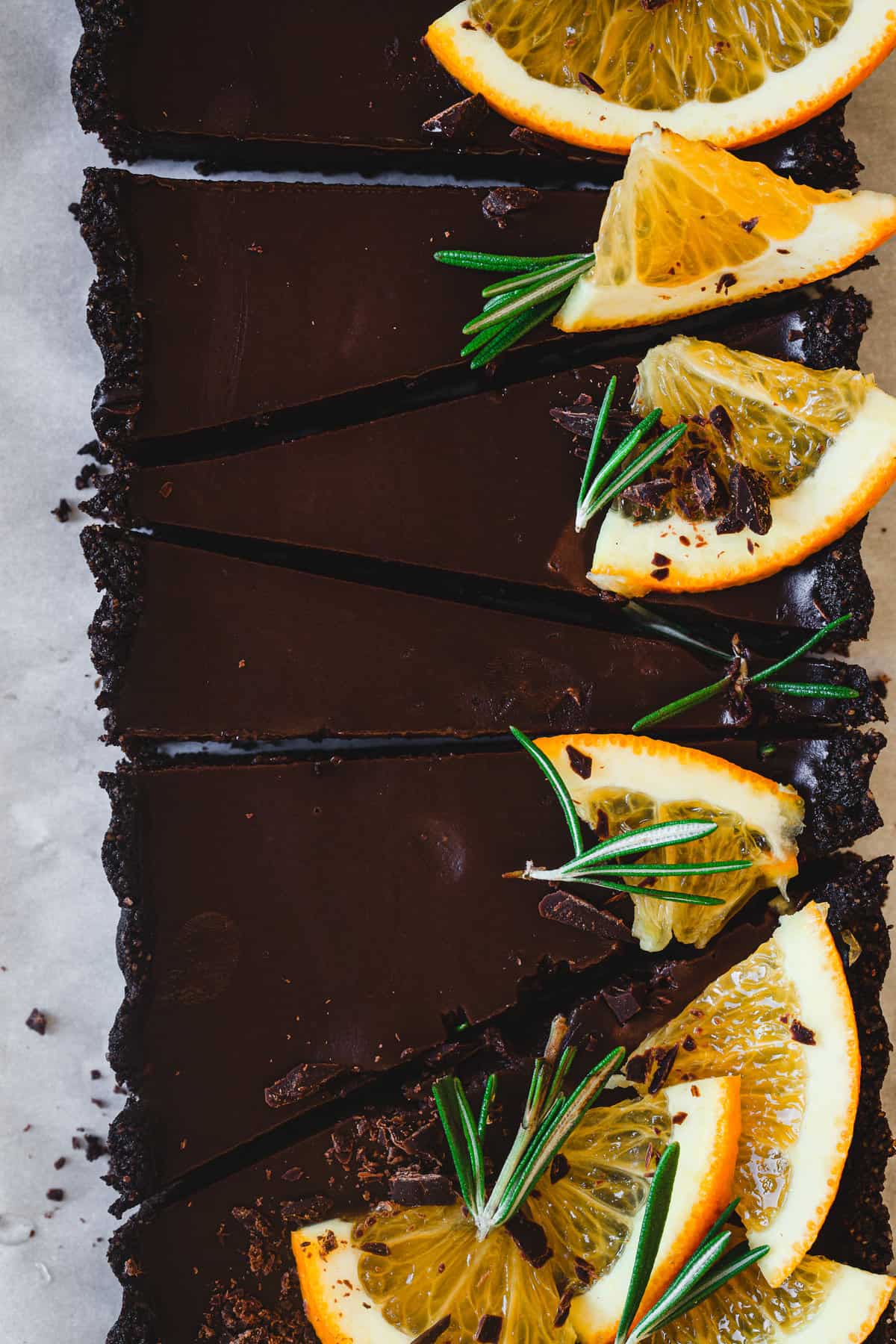 close up on decorated orange chocolate tart slices