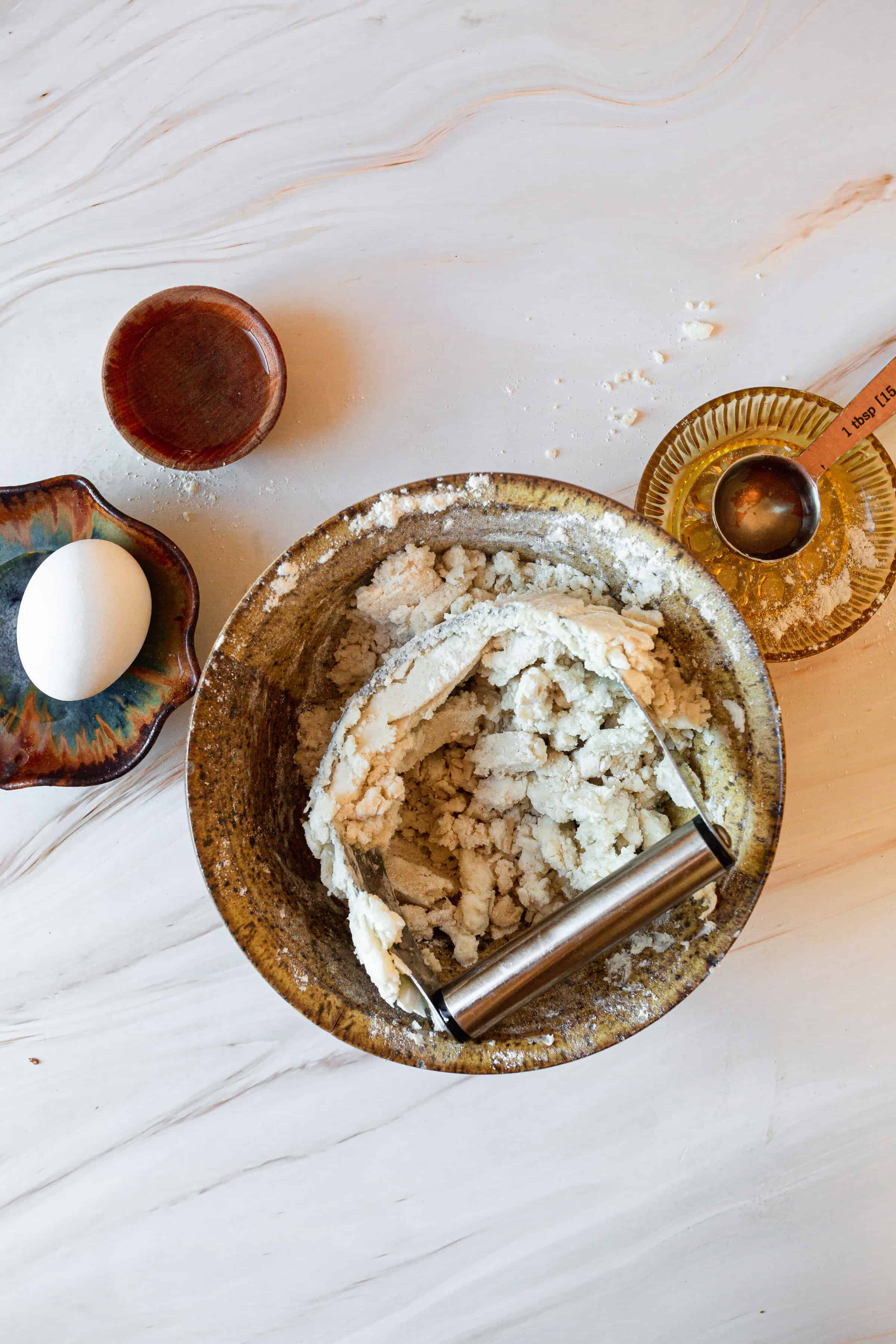 ingredients in wooden bowl with mixing device