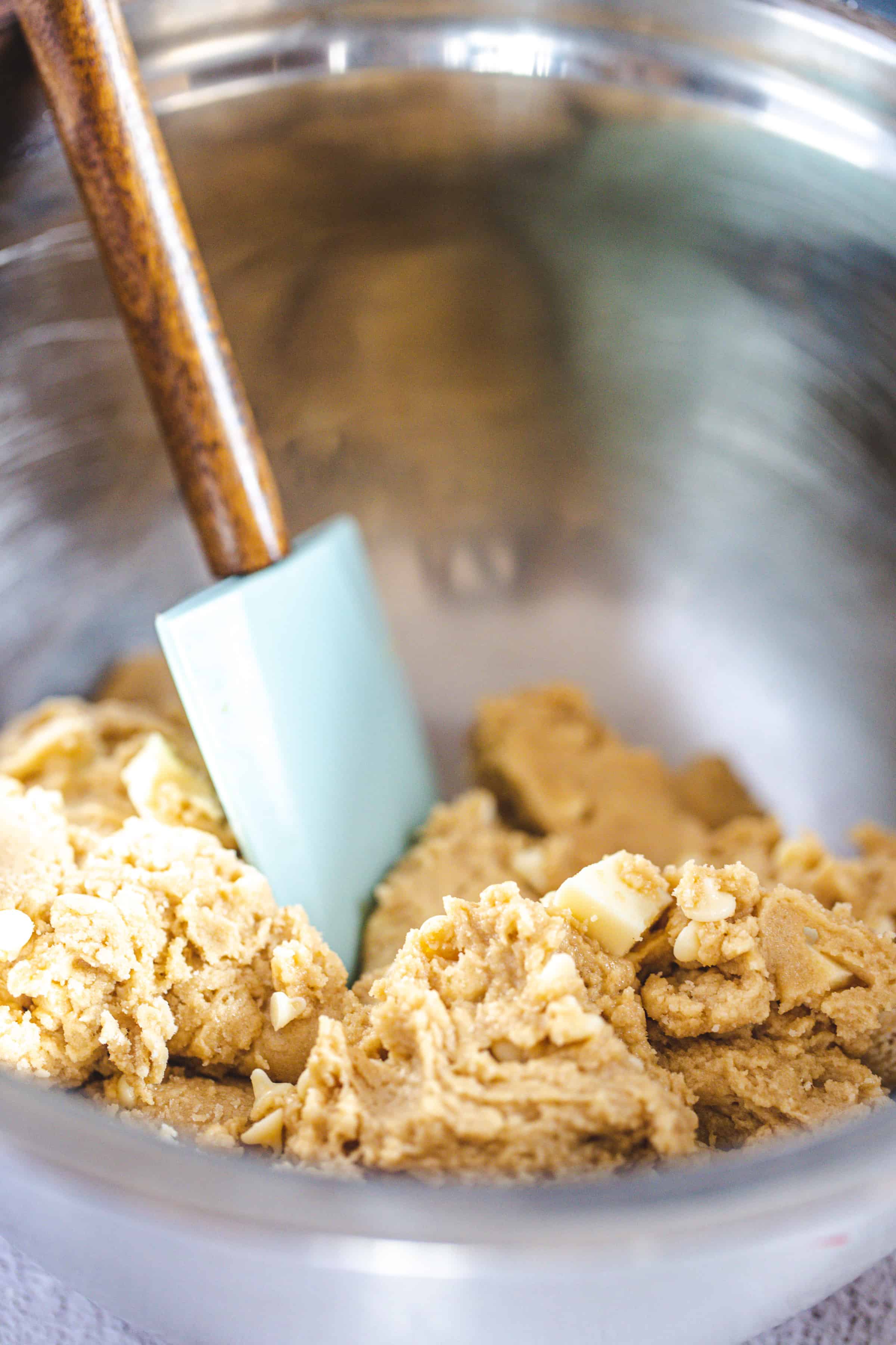 mixing cookie dough in bowl