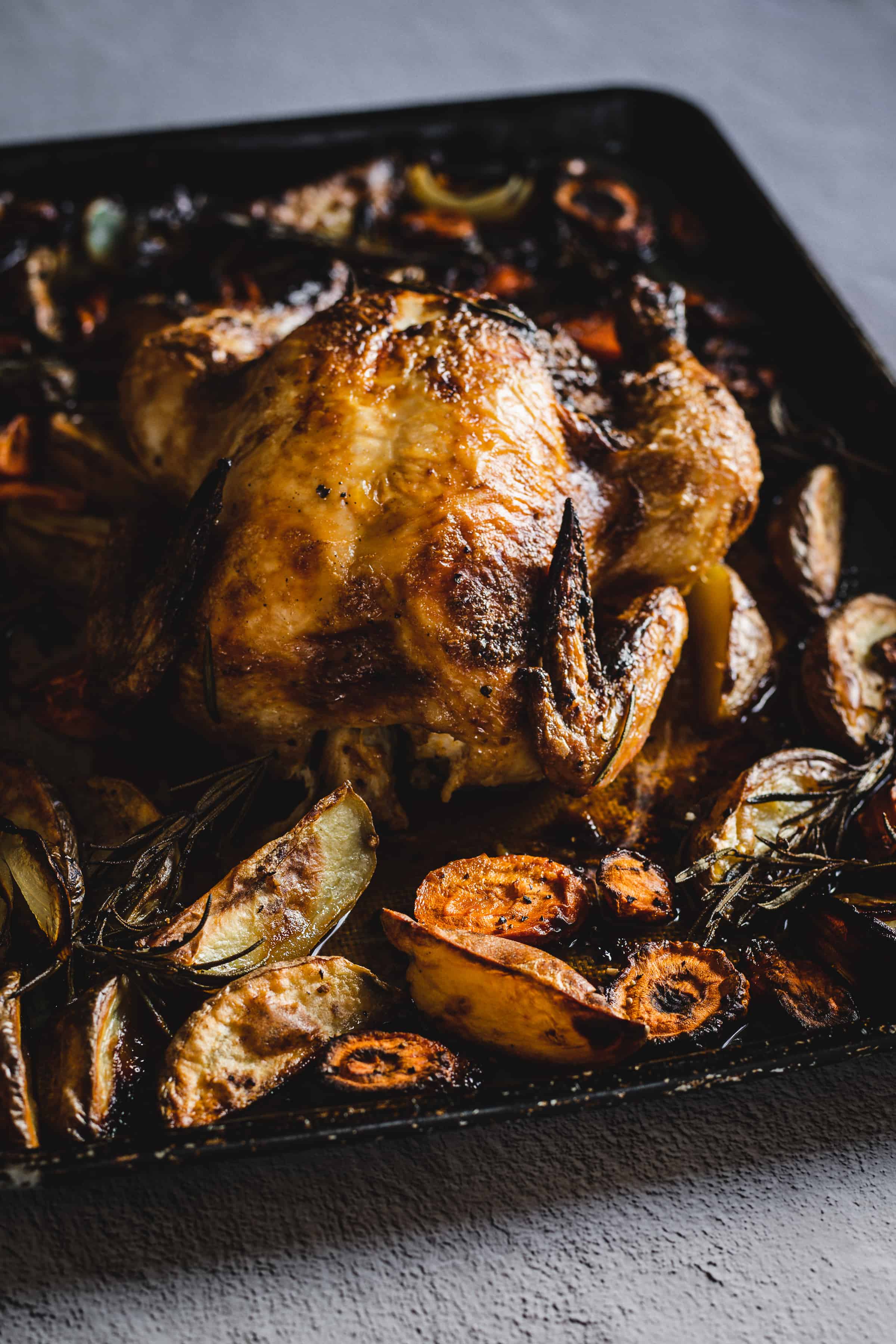 side view of roasted chicken tray bake