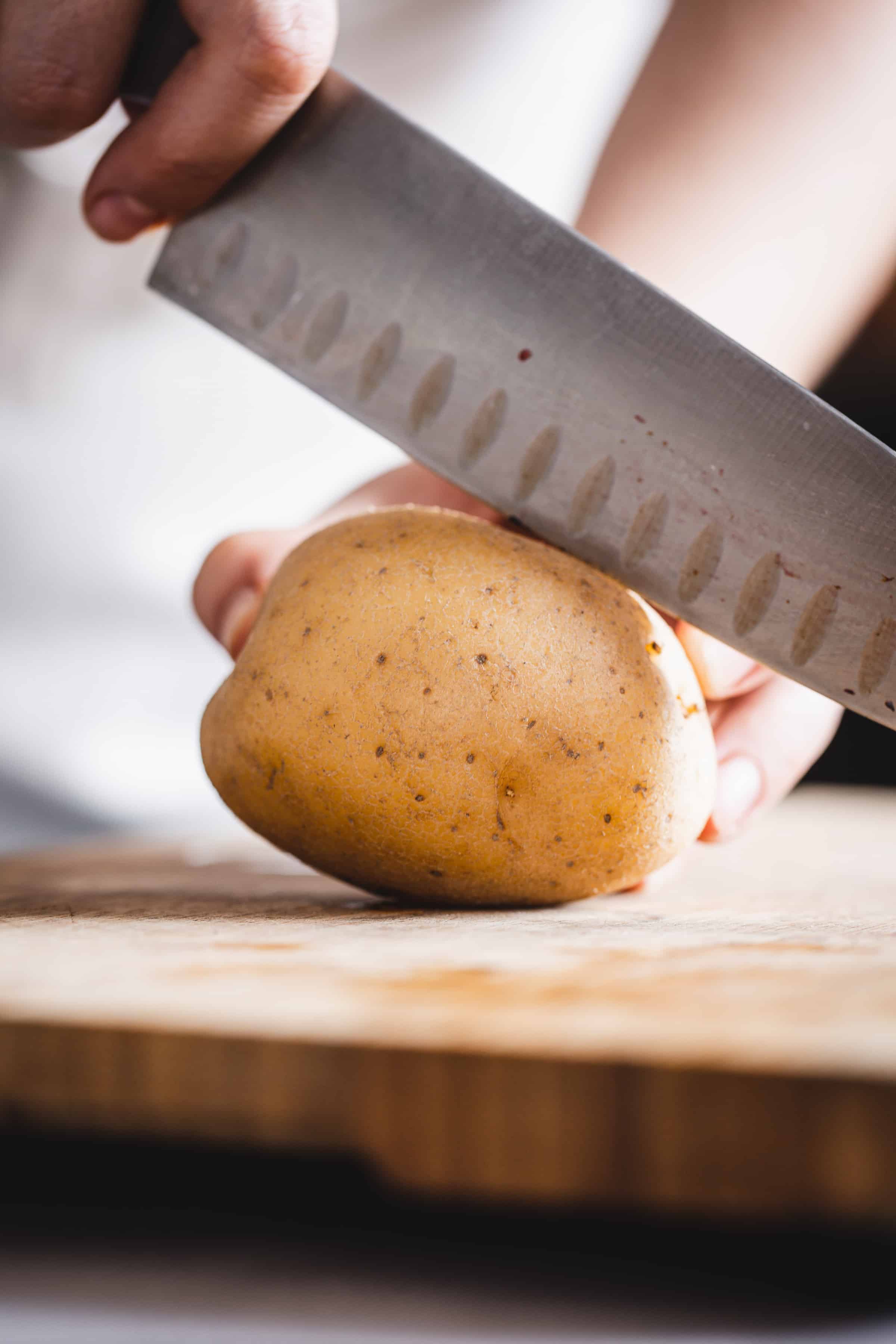 dicing potatoes for sheet pan chicken and veggies