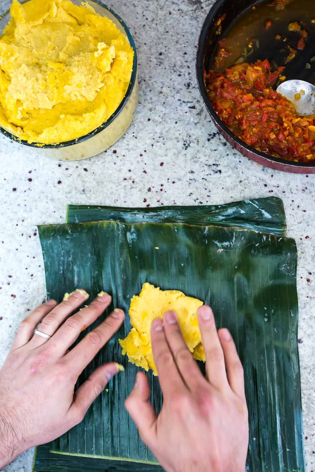 placing masa in tamal colombiano