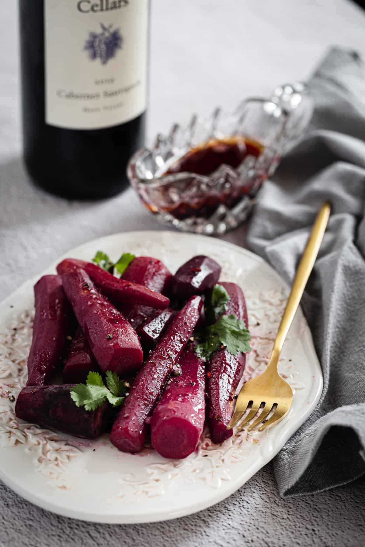 wine glazed carrots with parsley with fork and wine