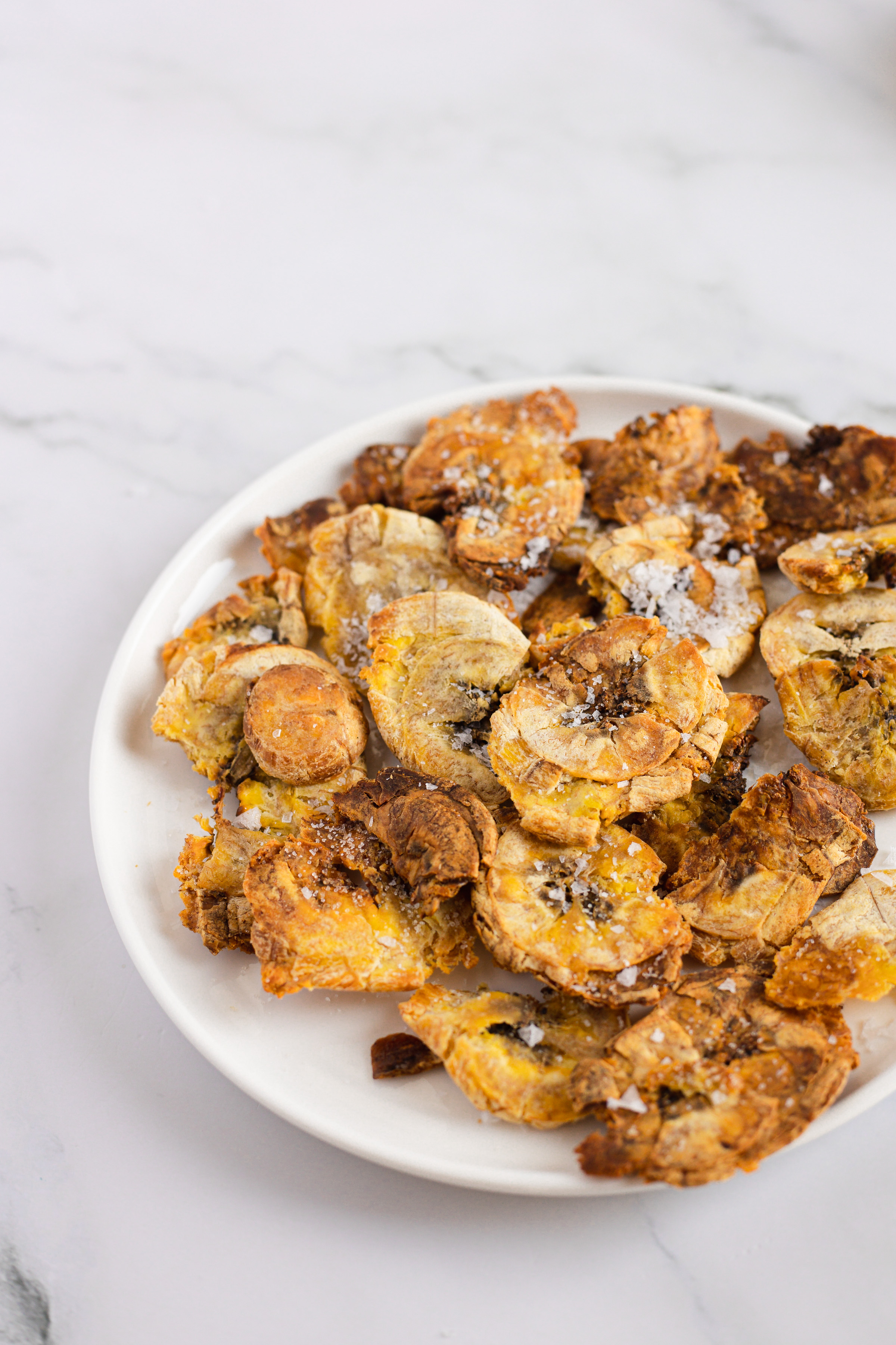 air fryer plantain tostones on white plate
