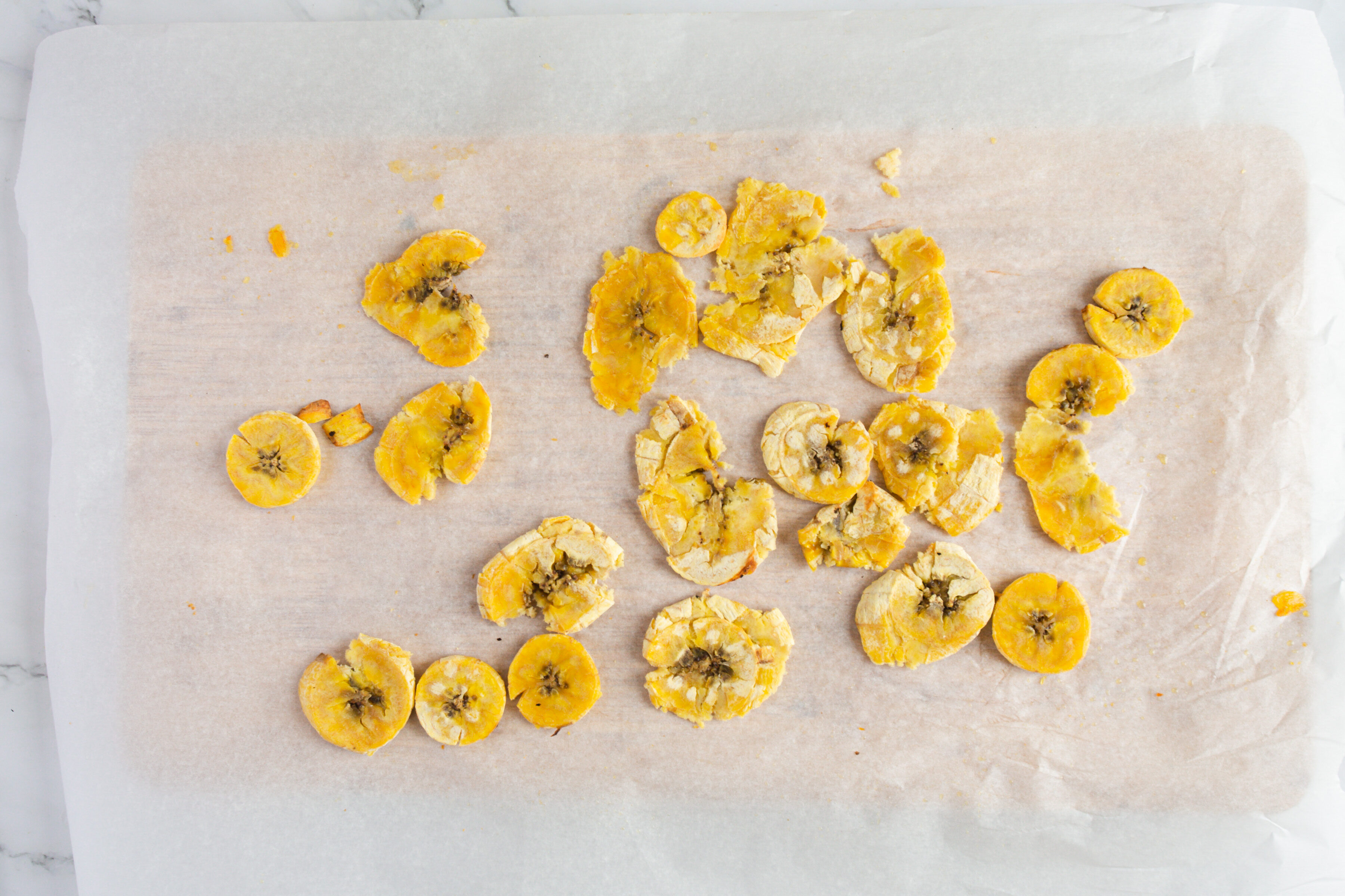 plantain slices on baking sheet