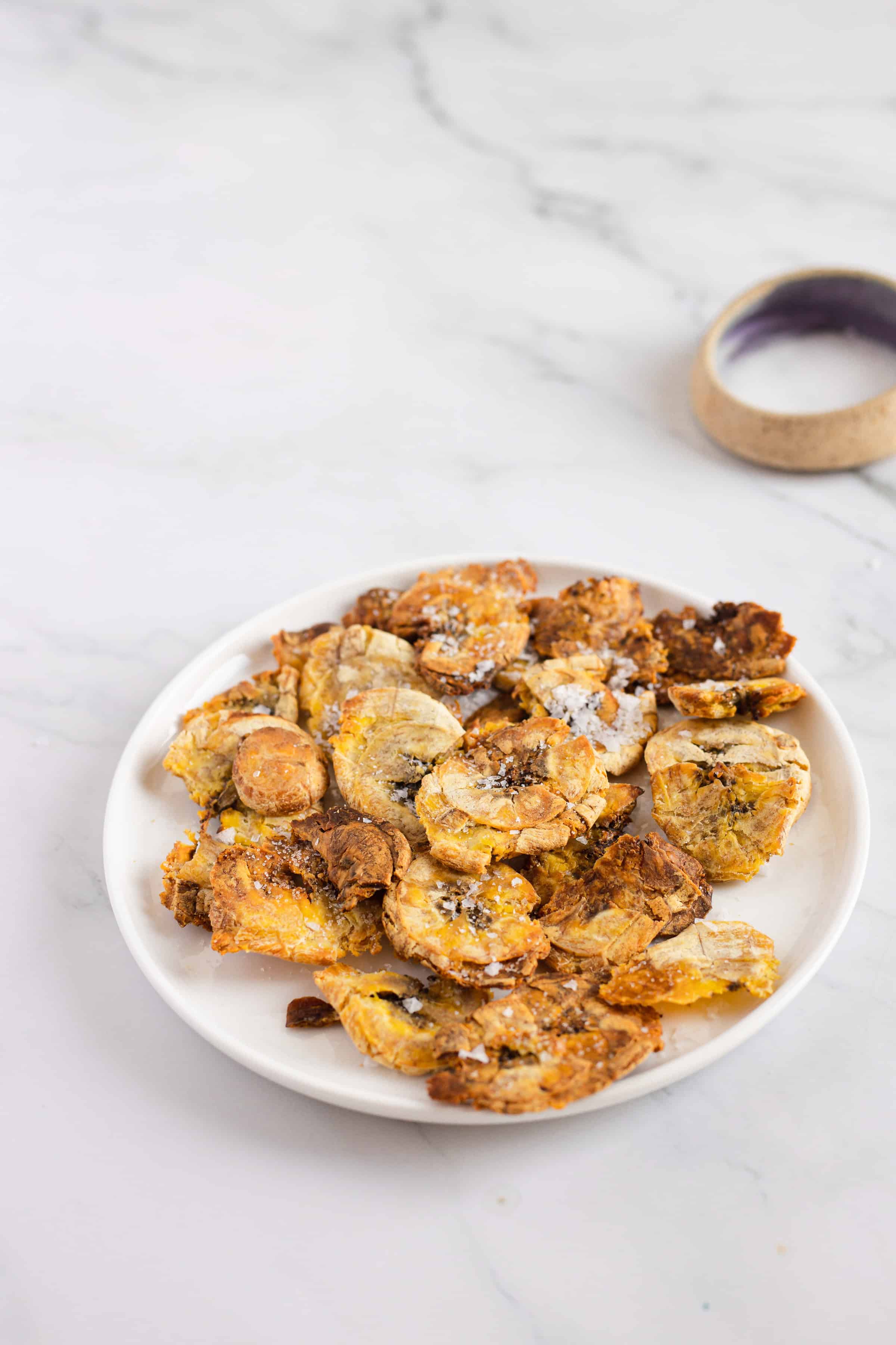 air fryer plantain tostones on white plate