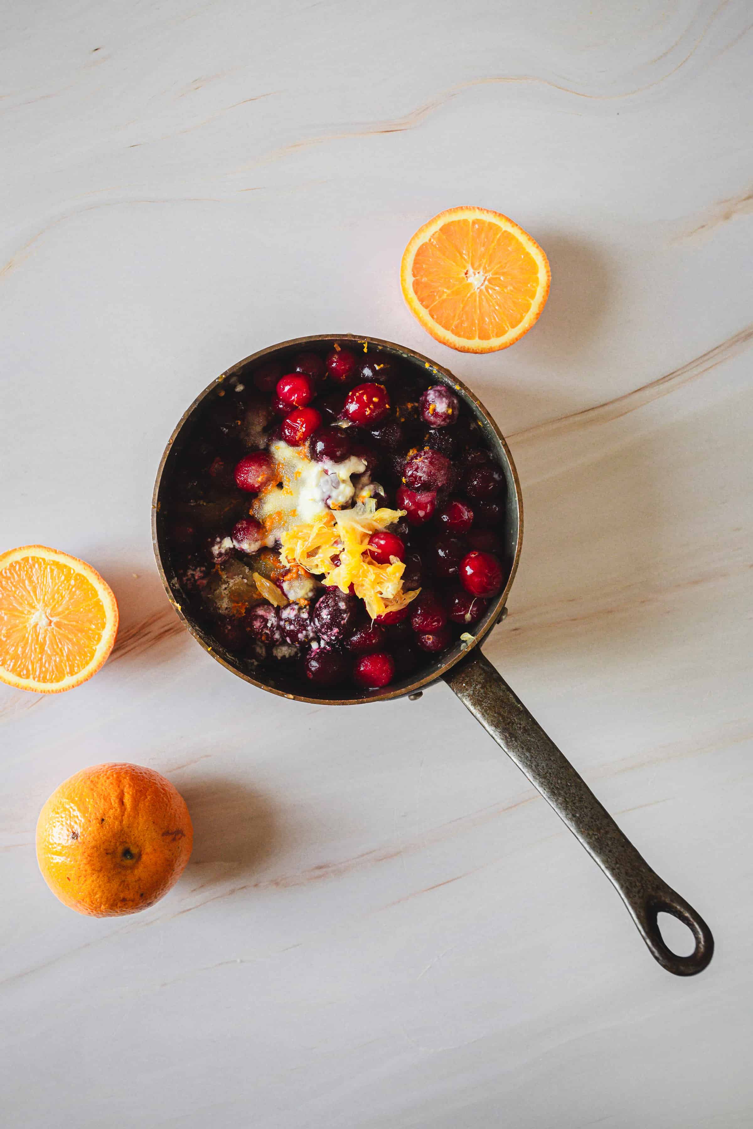 small pan with cranberries and orange