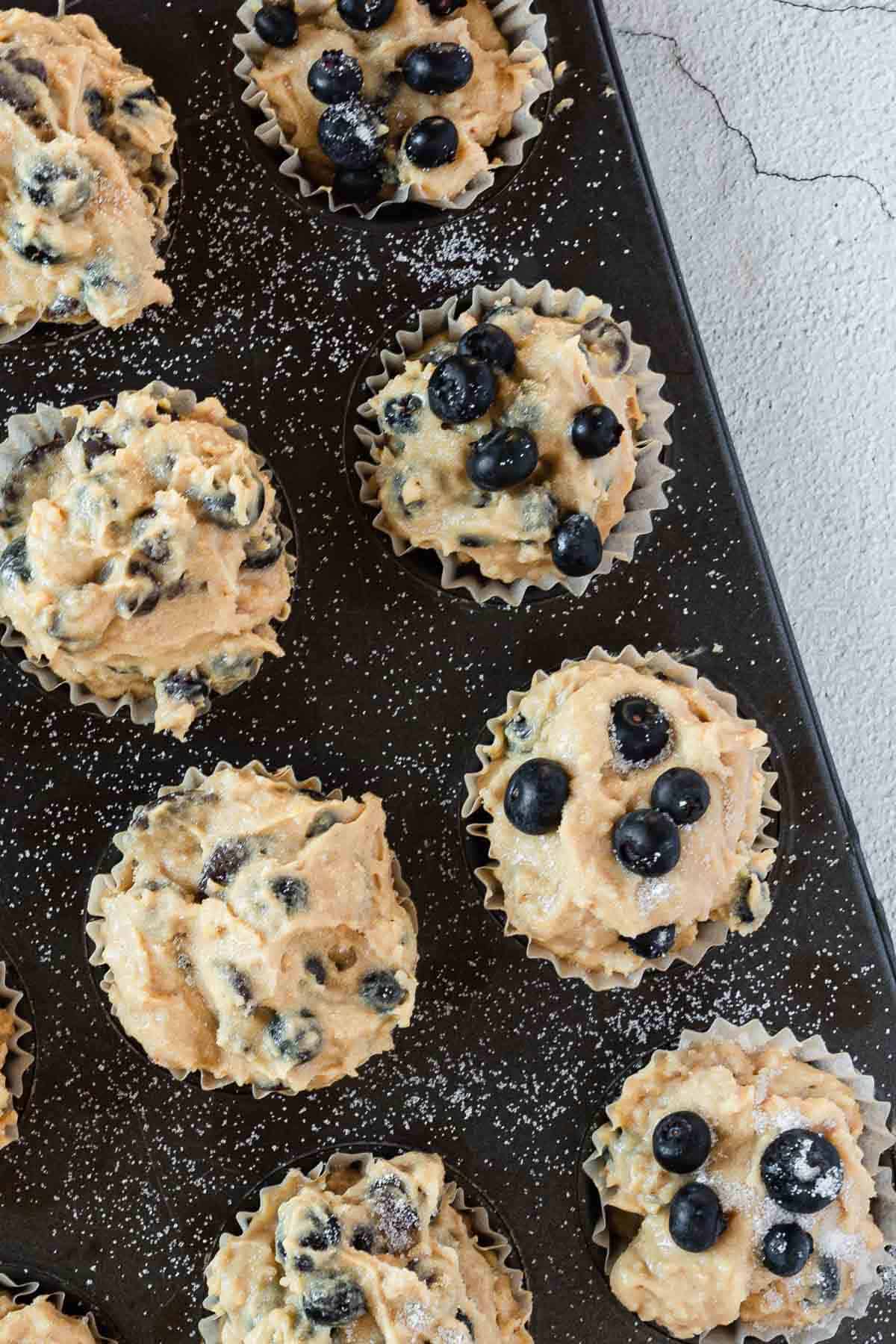 blueberry gluten free muffins in baking tin