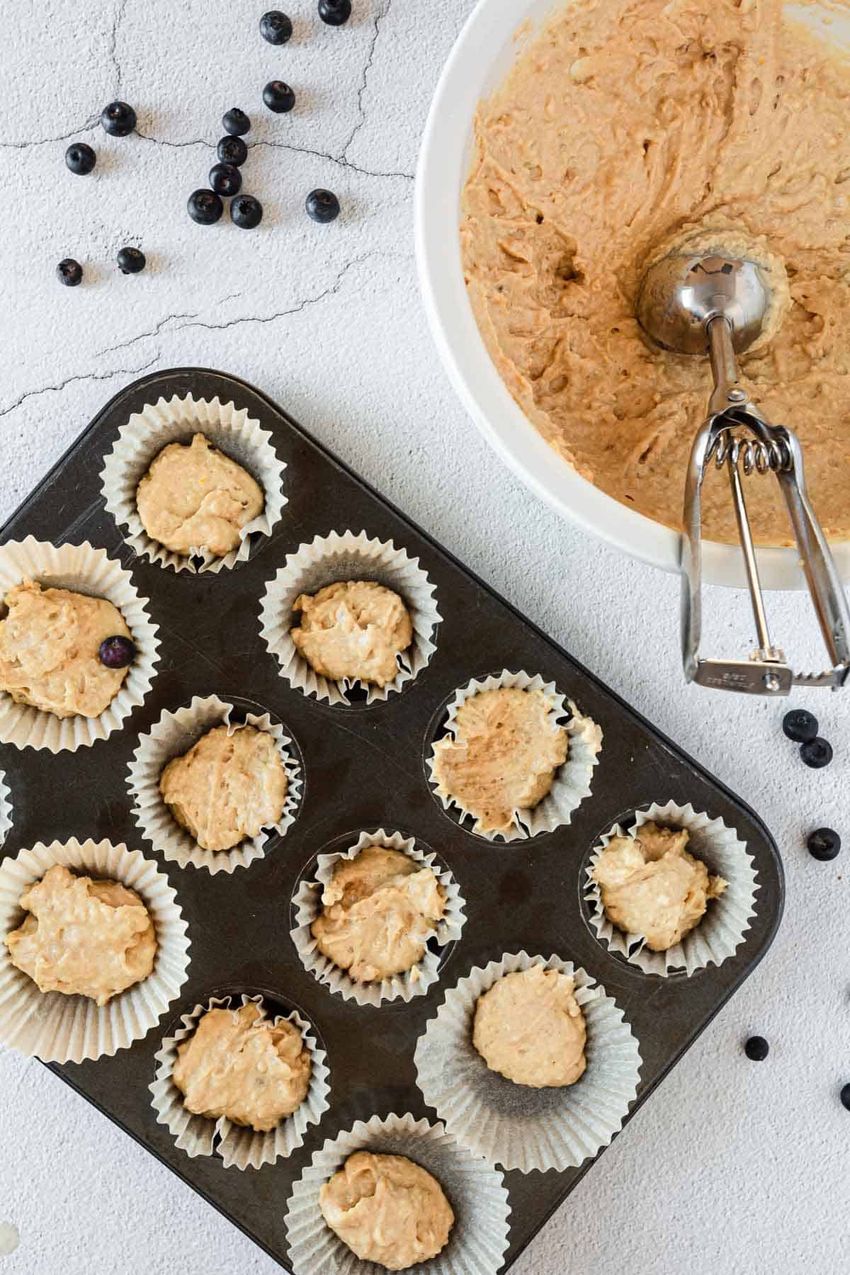 blueberry gluten free muffin batter and tin