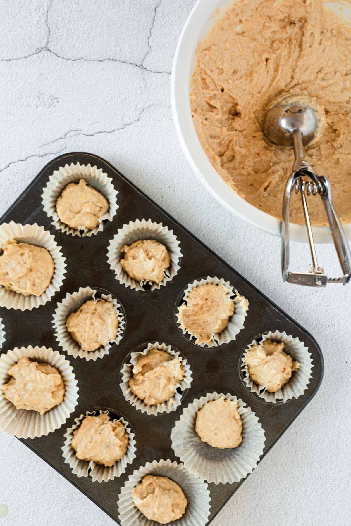 overhead of gluten free chocolate chip muffin batter and muffins in tray