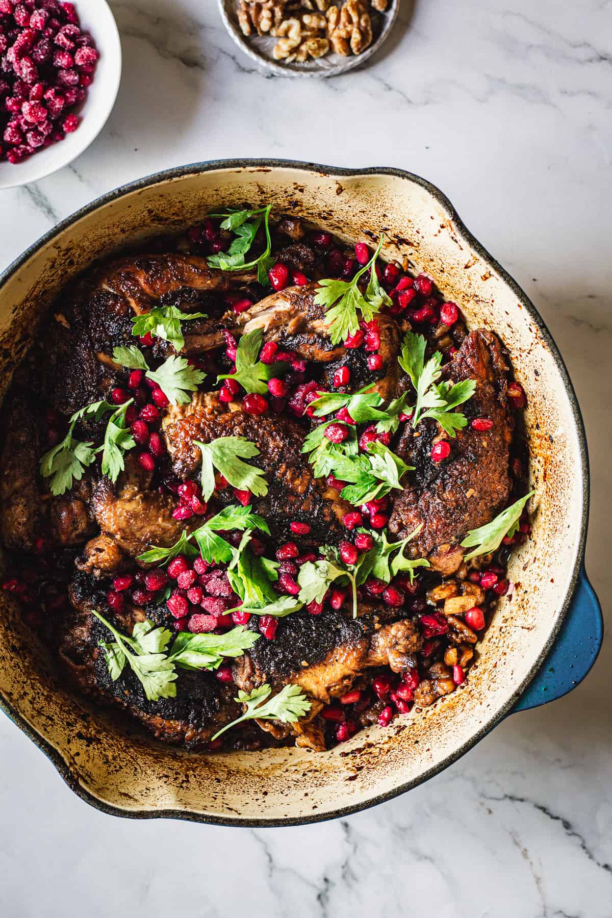 Roasted chicken with pomegranate and pomegranate seeds.