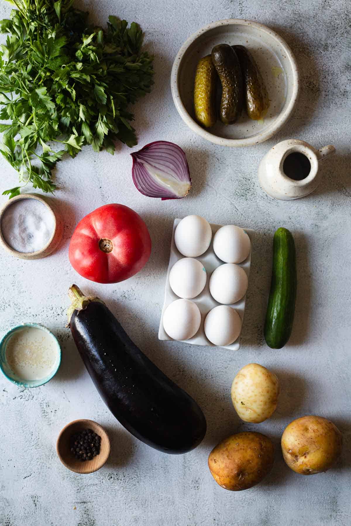 The ingredients for a hummus recipe are laid out on a table.