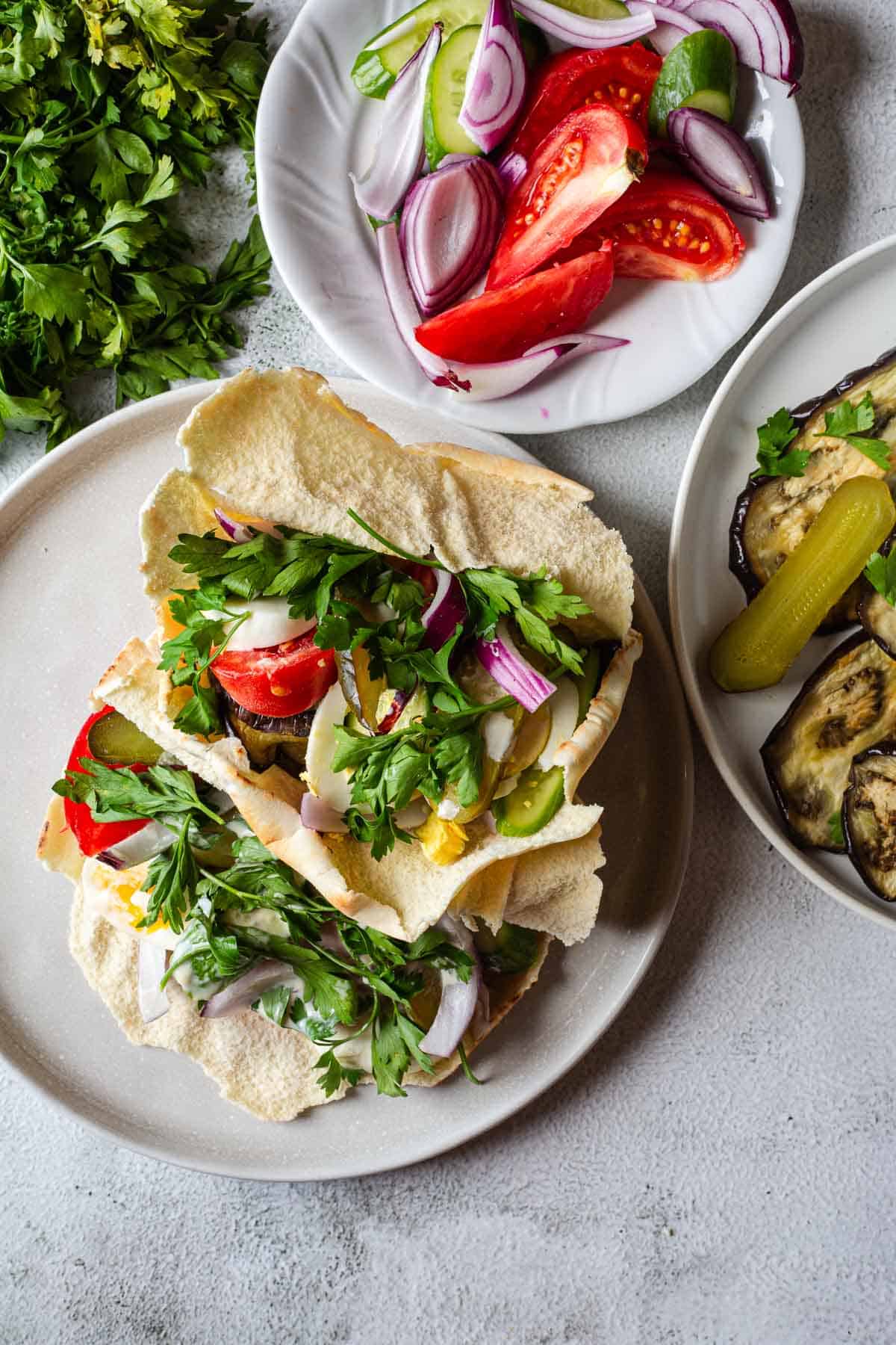 A plate of pita bread with vegetables on it.