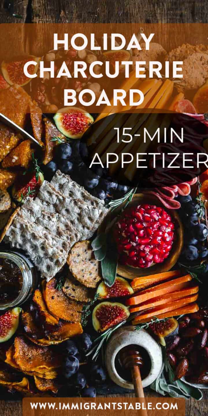 A thanksgiving charcuterie board with the text holiday charcuterie board 15 min appetizer.