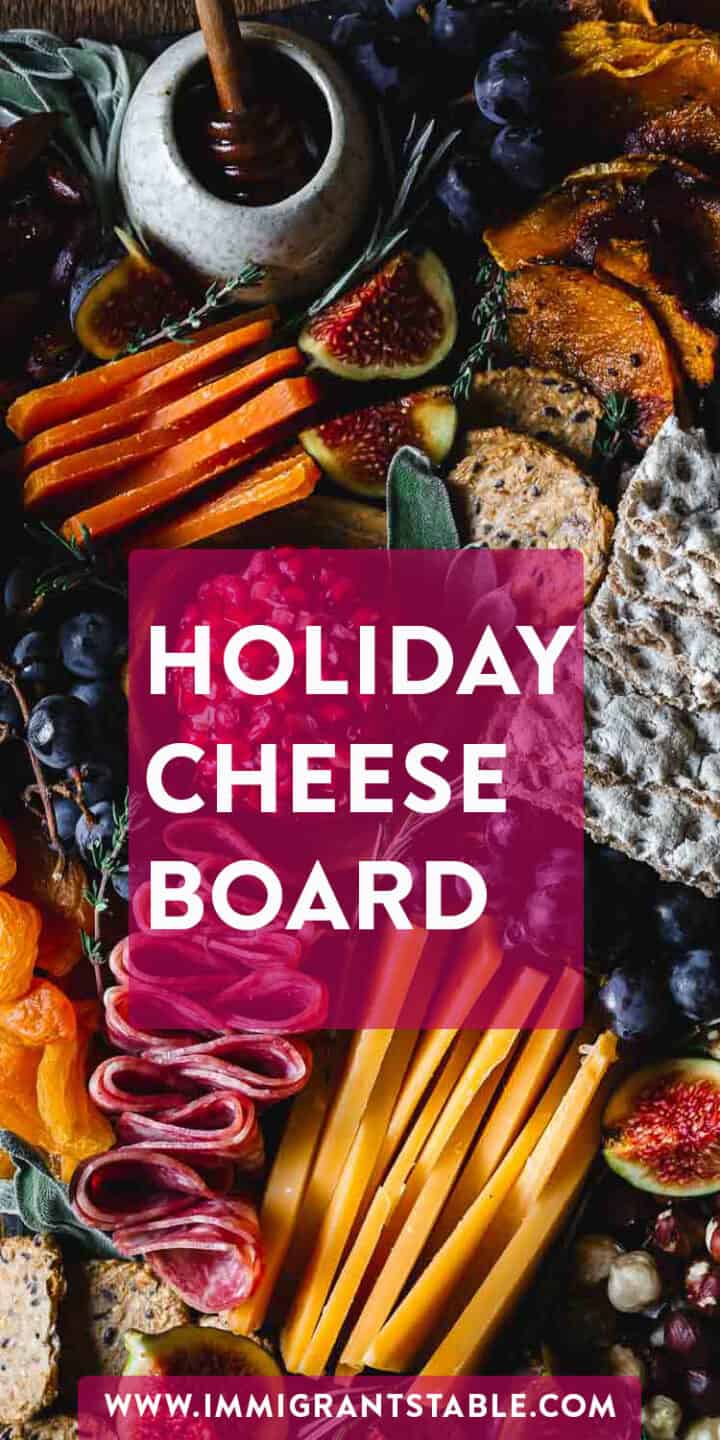 Thanksgiving charcuterie board featuring a variety of delectable cheeses and accompaniments.