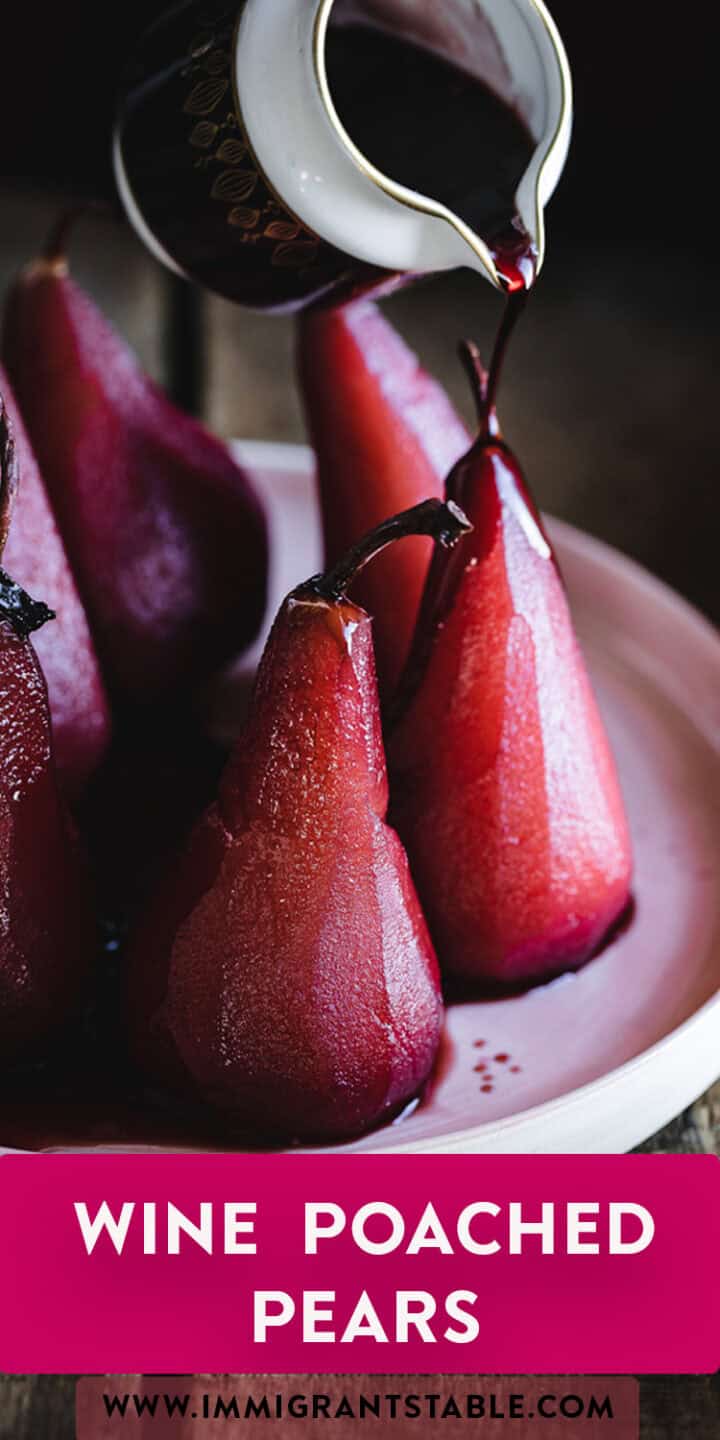 A close-up image of red wine being poured over vibrant, glistening poached pears on a white plate. The text "Wine Poached Pears" is displayed at the bottom in a magenta bar with a website URL below it, perfectly capturing the essence of wine poached pears.