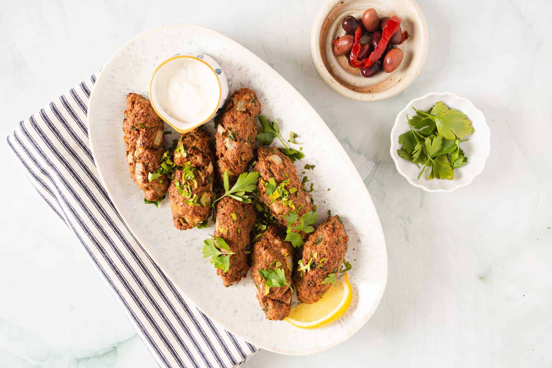 kofta kebabs with tahini sauce.