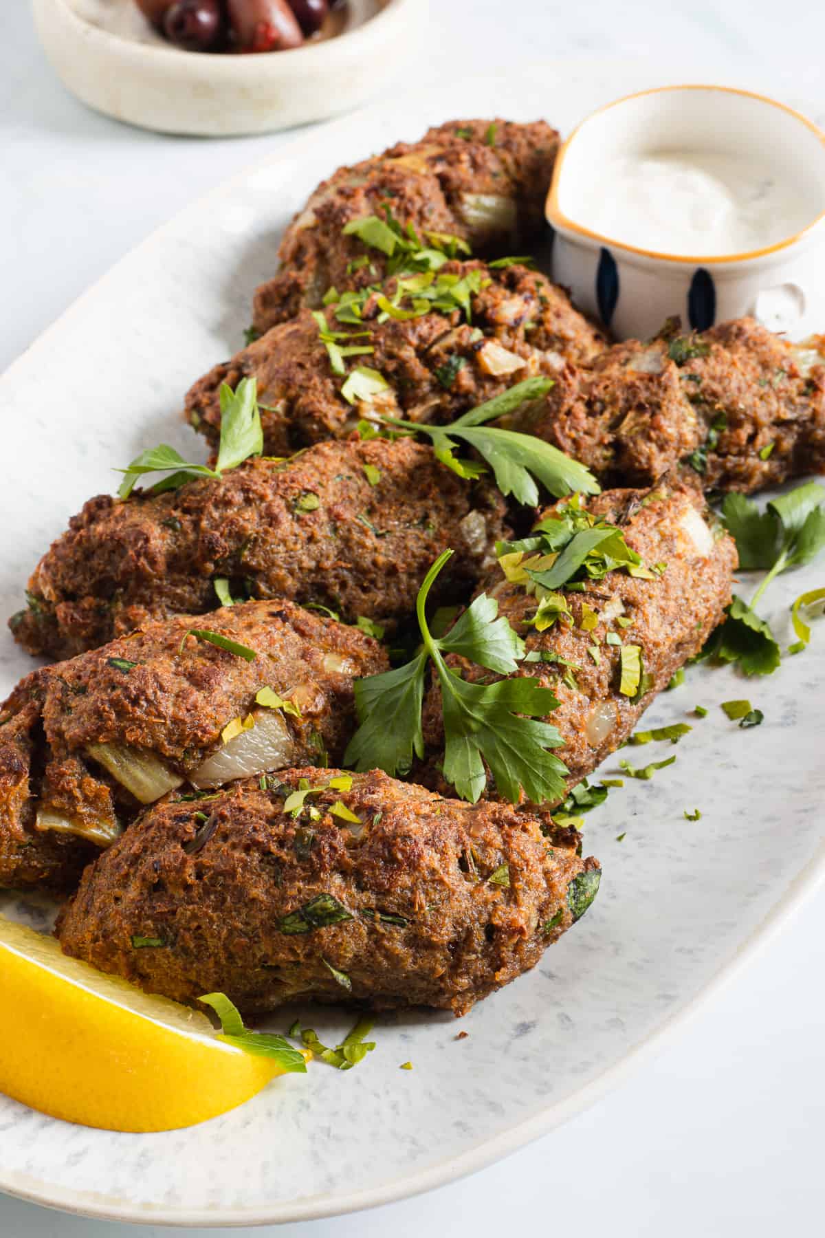 beyond meat kofta kebabs with tahini sauce.