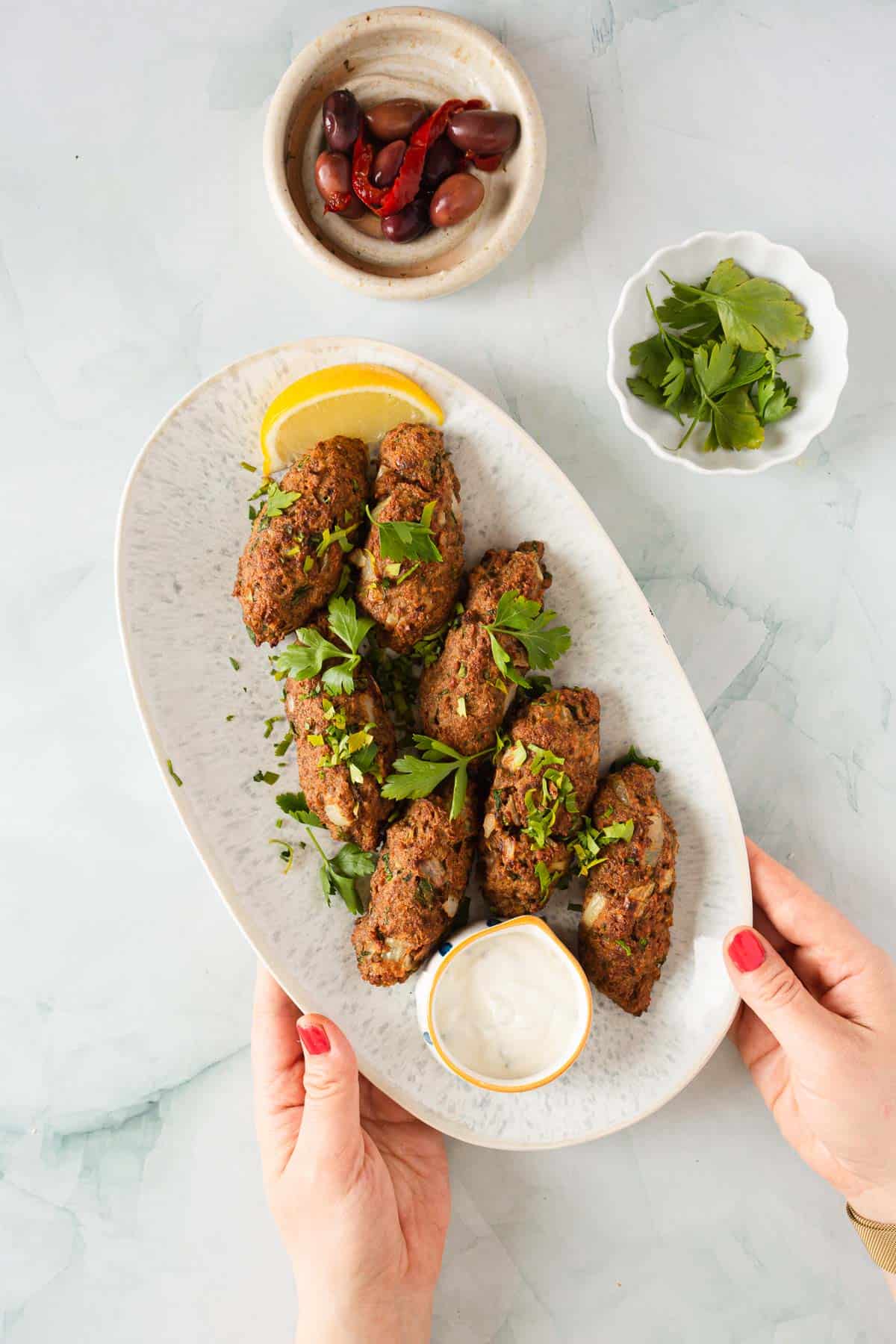 kofta kebabs with tahini sauce.