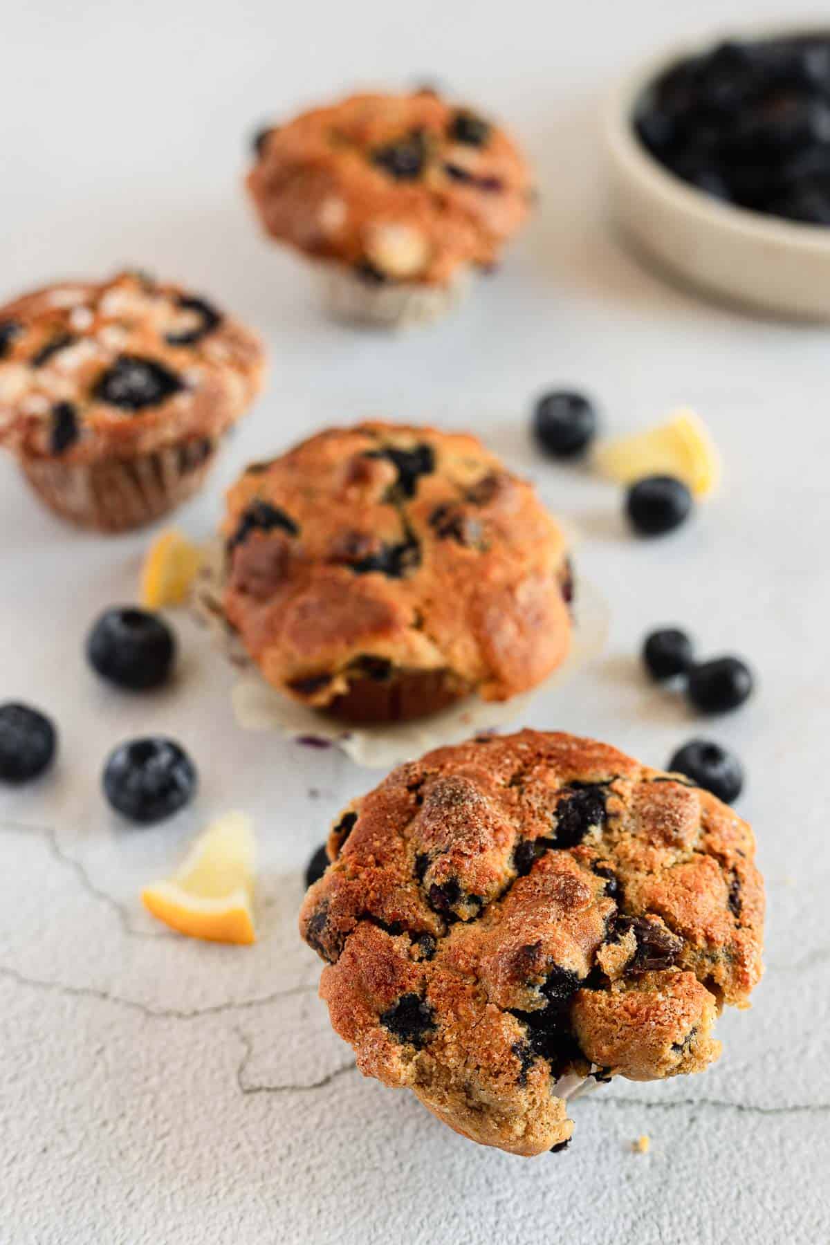 Gluten free blueberry muffins with orange slices and blueberries.