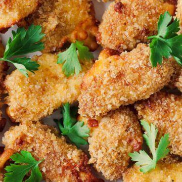 Close up on cheese curds on plate.