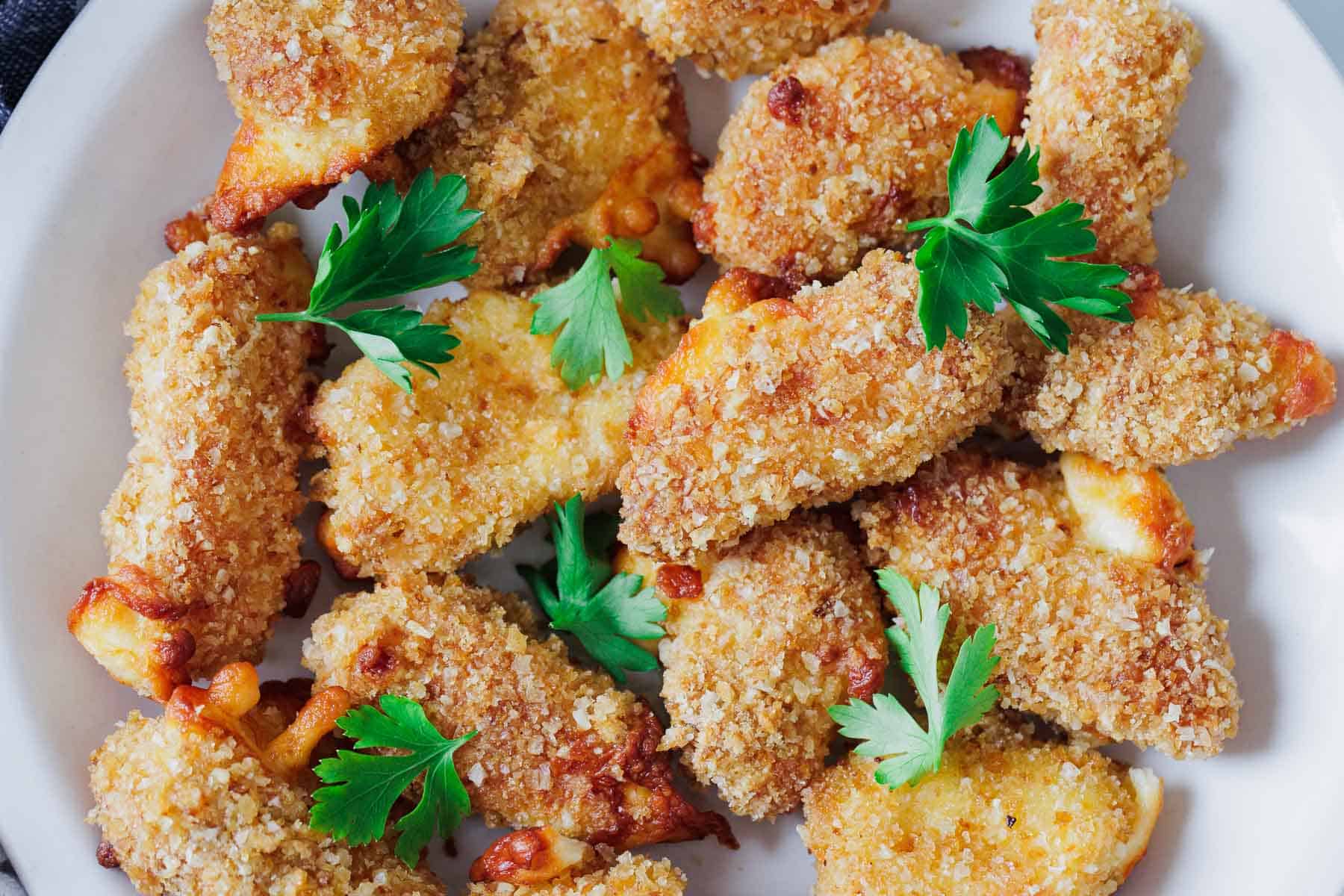 Close up of Fried cheese curds on a plate.