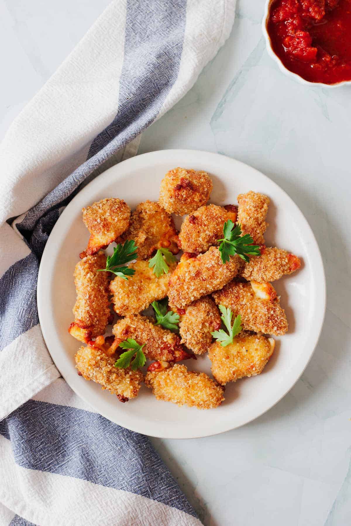 A plate of fresh air fried cheese curds.