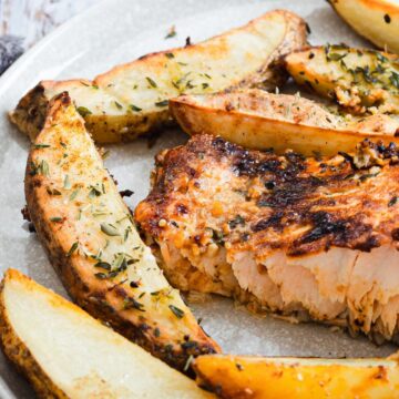 salmon on plate with potatoes