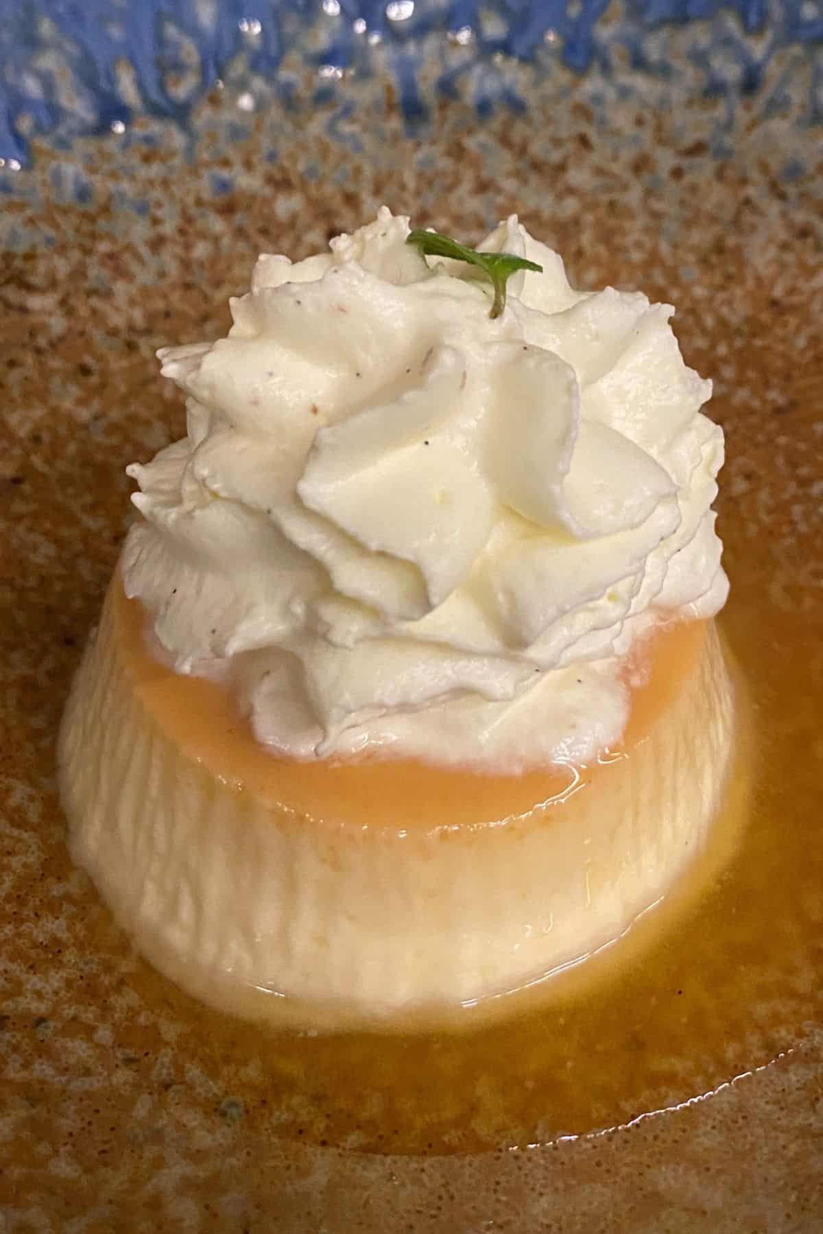 Colombian flan de coco with whipped cream