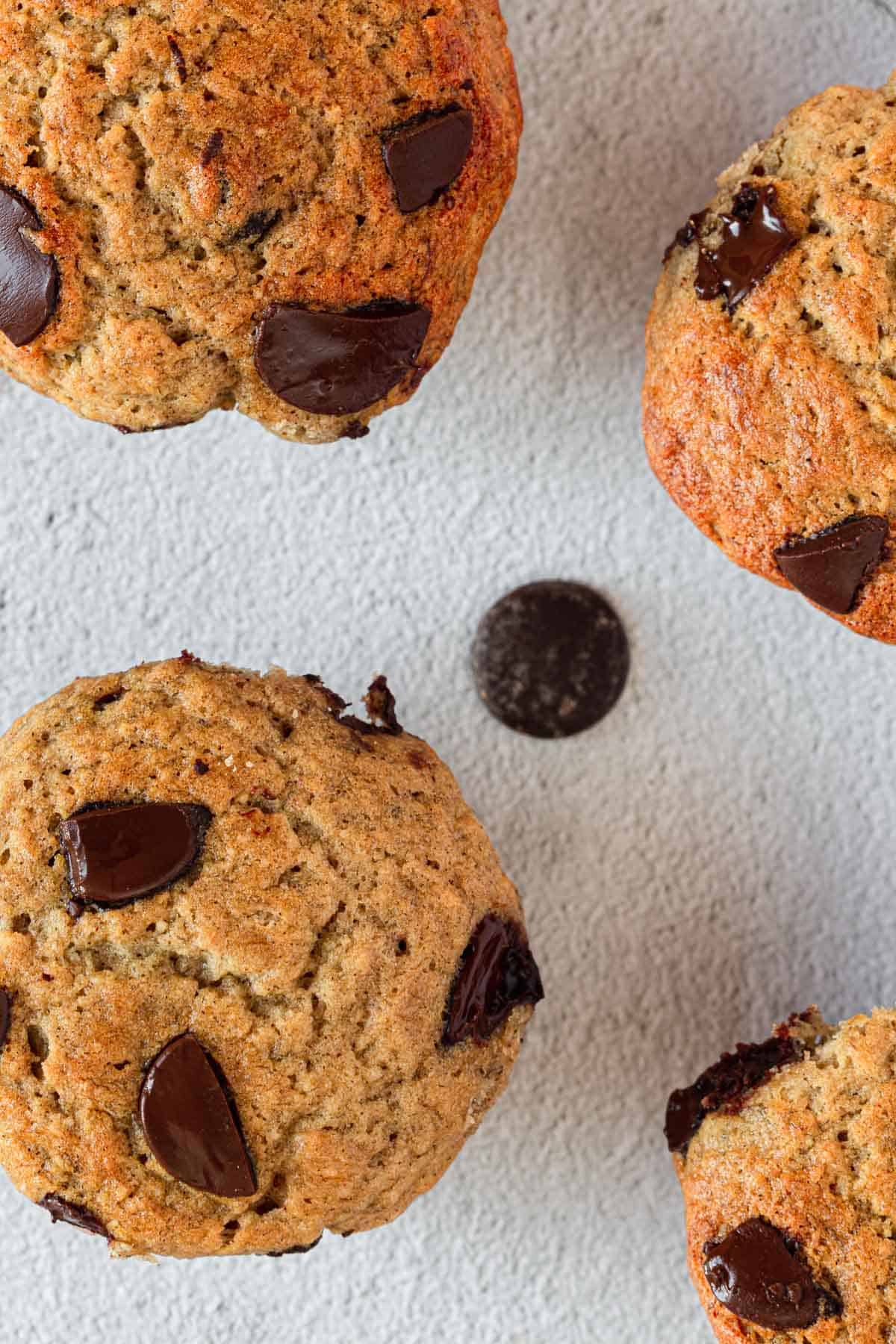 Banana Chocolate chip muffins on a white plate.