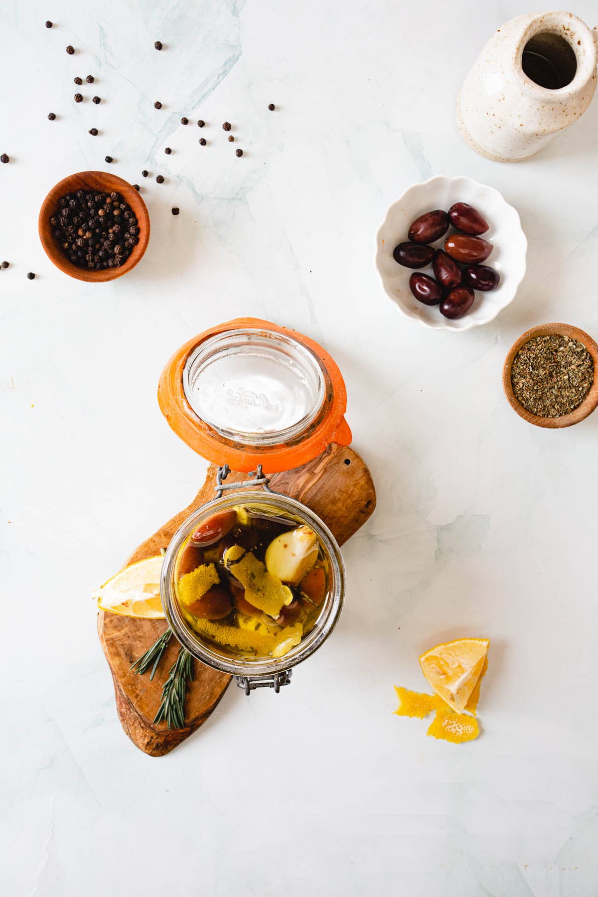 overhead of marinated cheese curds in a jar.