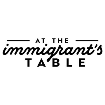 At the immigrant's healthy international recipes table logo.