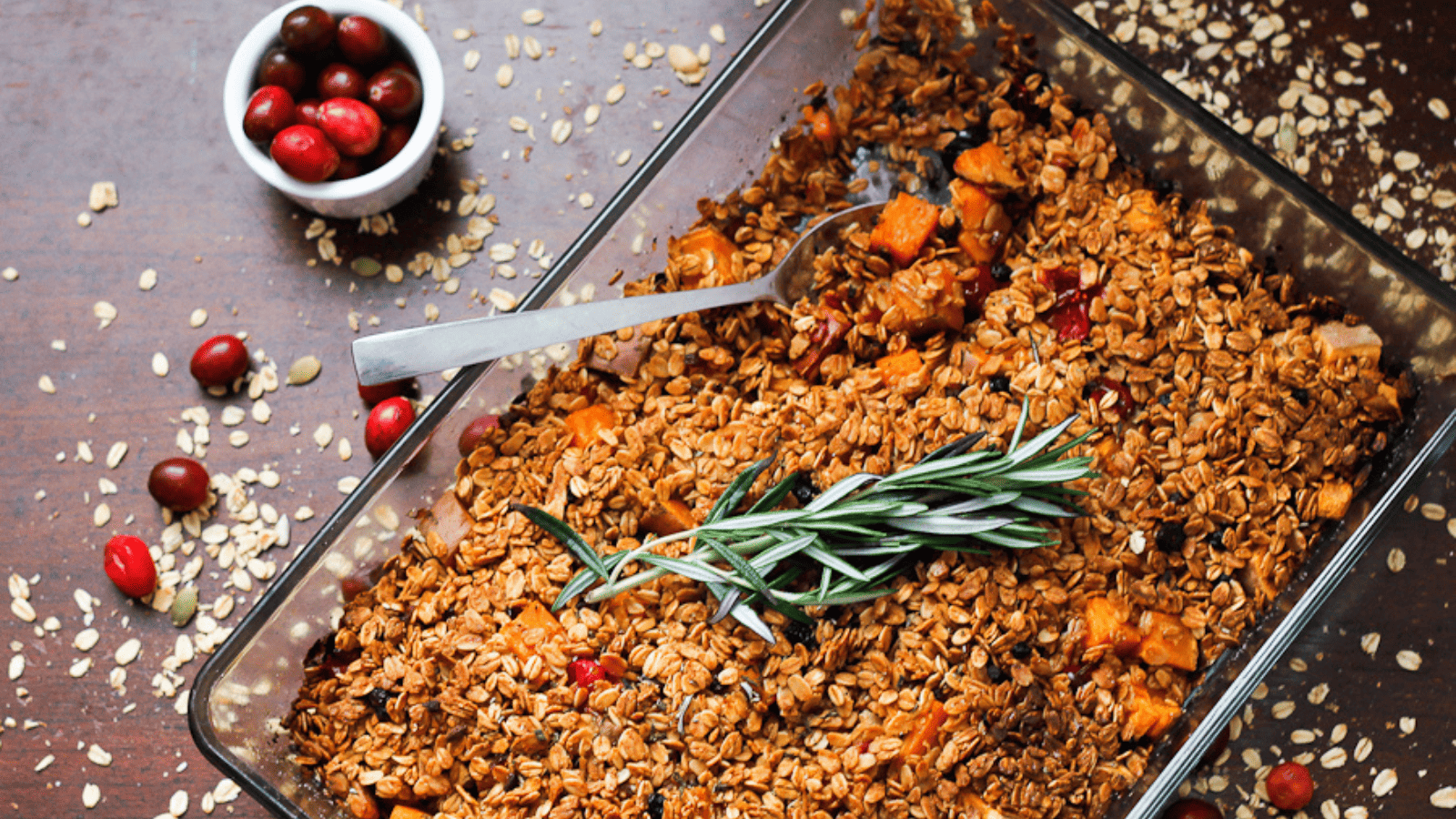 A dish of granola with cranberries and sprigs of rosemary from Mom's recipes.