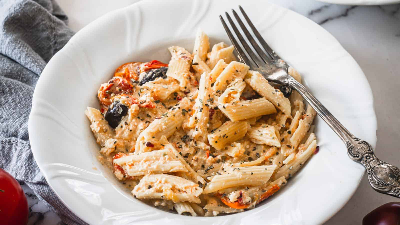 Side view of baked feta pasta on a plate.