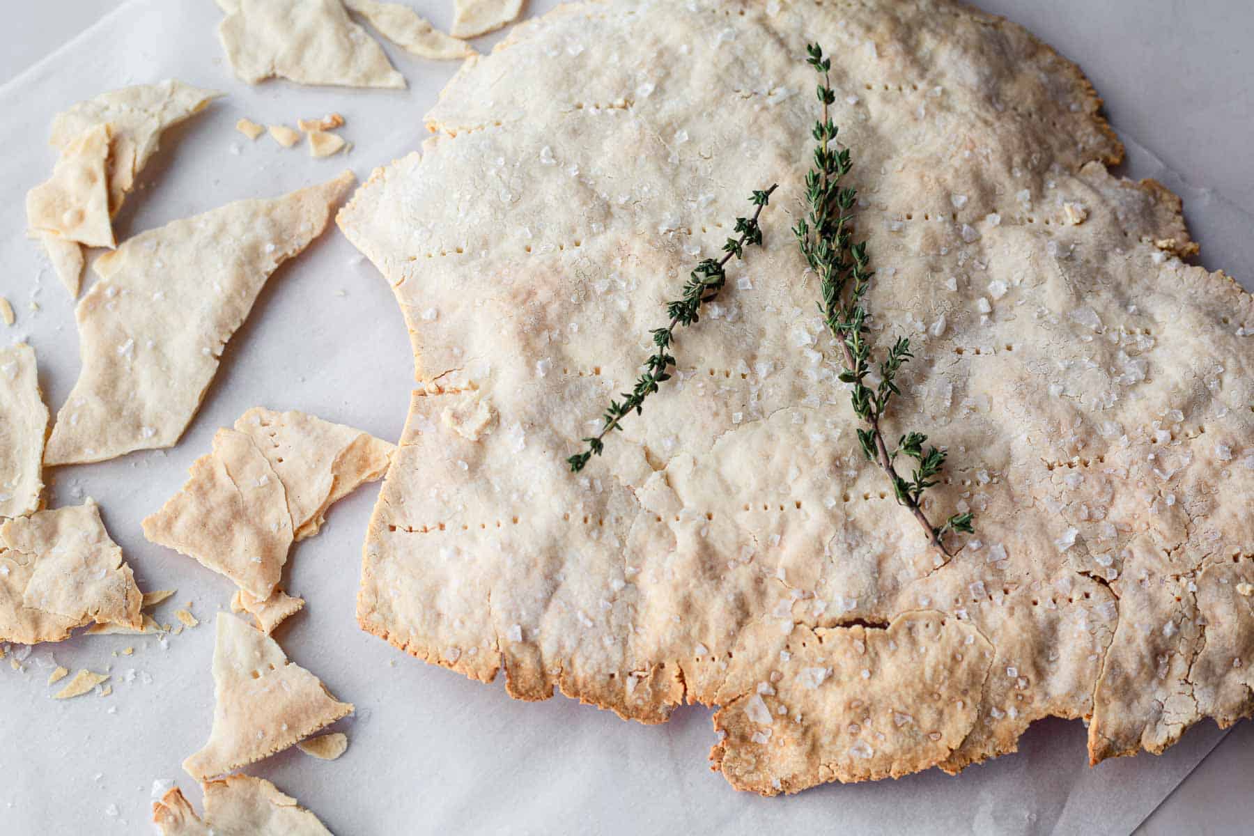 matzo whole and broken with thyme leaves