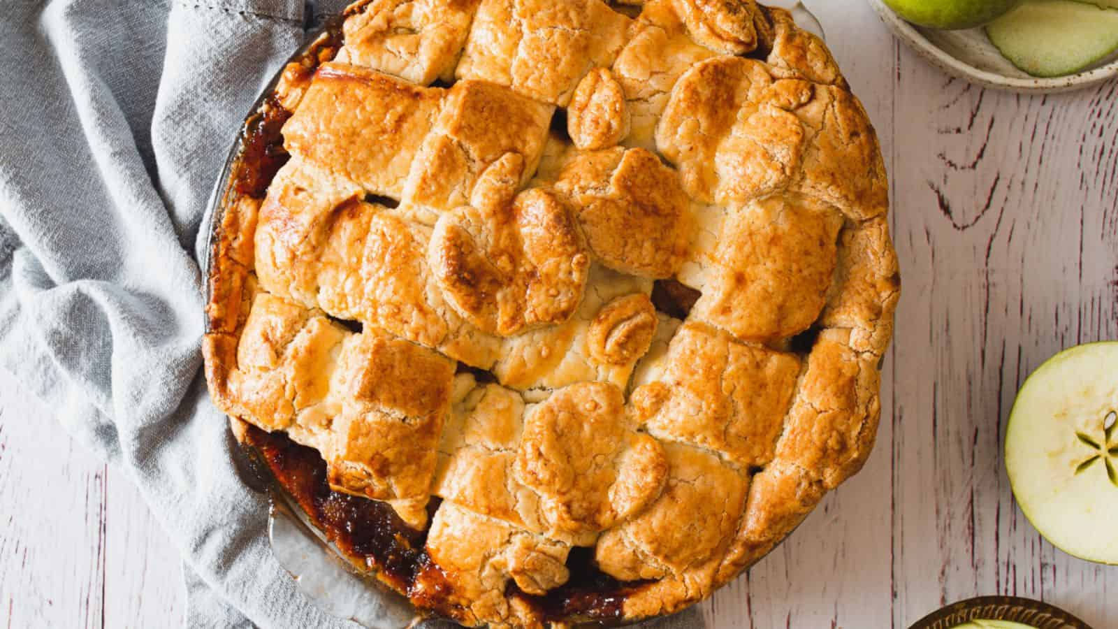 Overhead view of apple pie with apples.