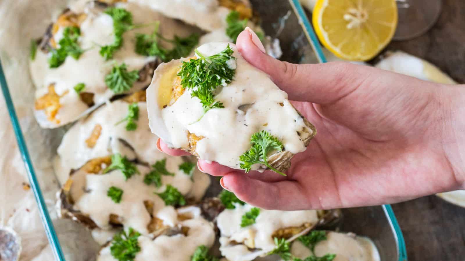 Osyter bake casserole on table with linen and herbs.