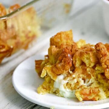 Slice of casserole in front of large casserole dish