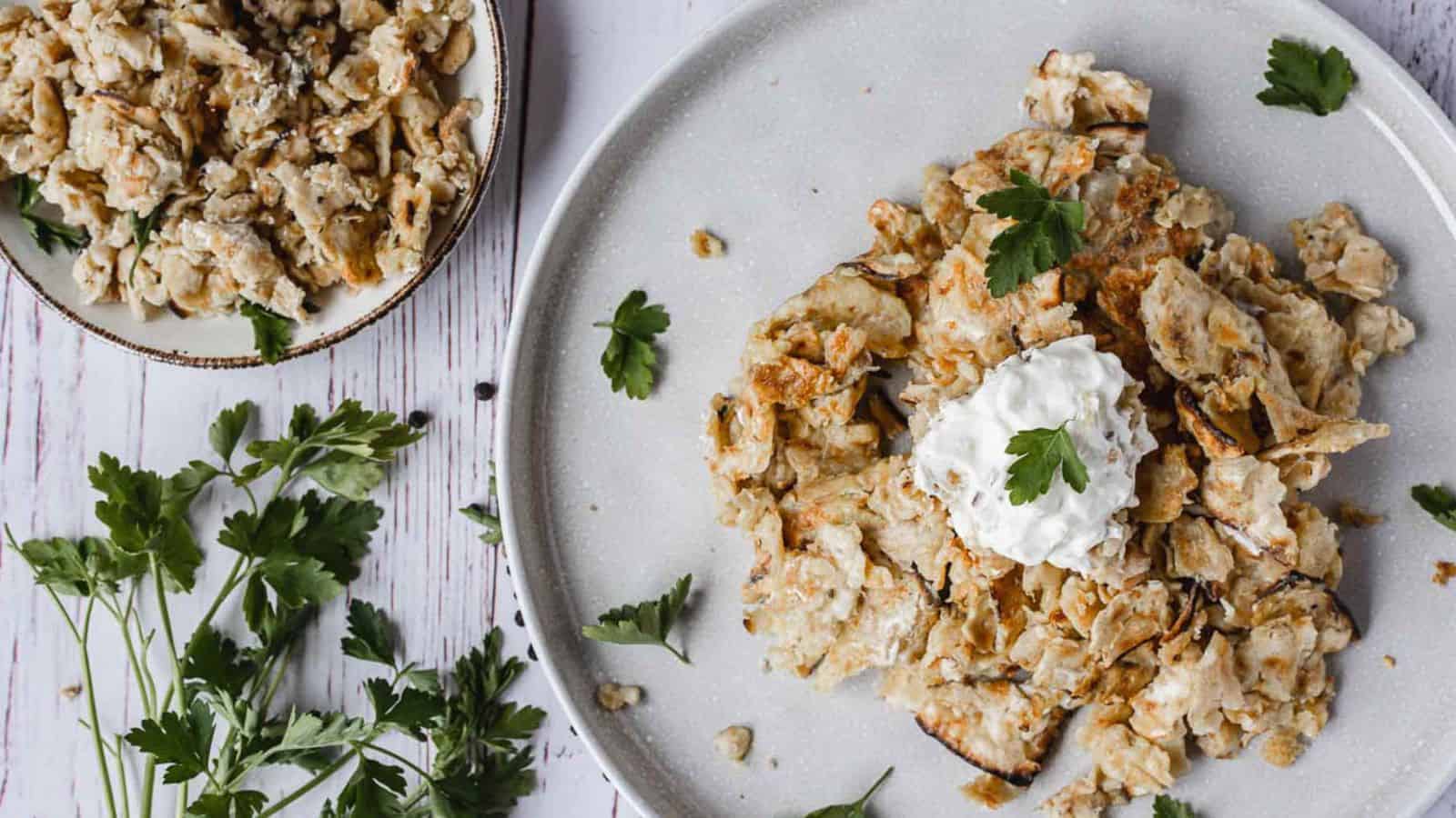 Matzo brei on two plates with parsely.