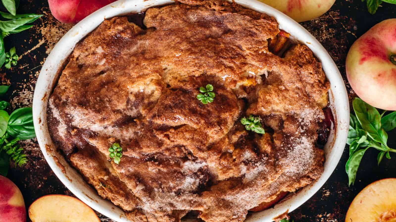 Overhead of peach cobbler on baking sheet.