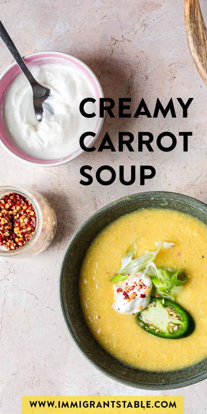 A bowl of creamy corn soup topped with a dollop of yogurt, cucumber slices, and herbs, next to a smaller bowl of yogurt and a container of spices. The text "creamy corn soup" is prominently displayed.