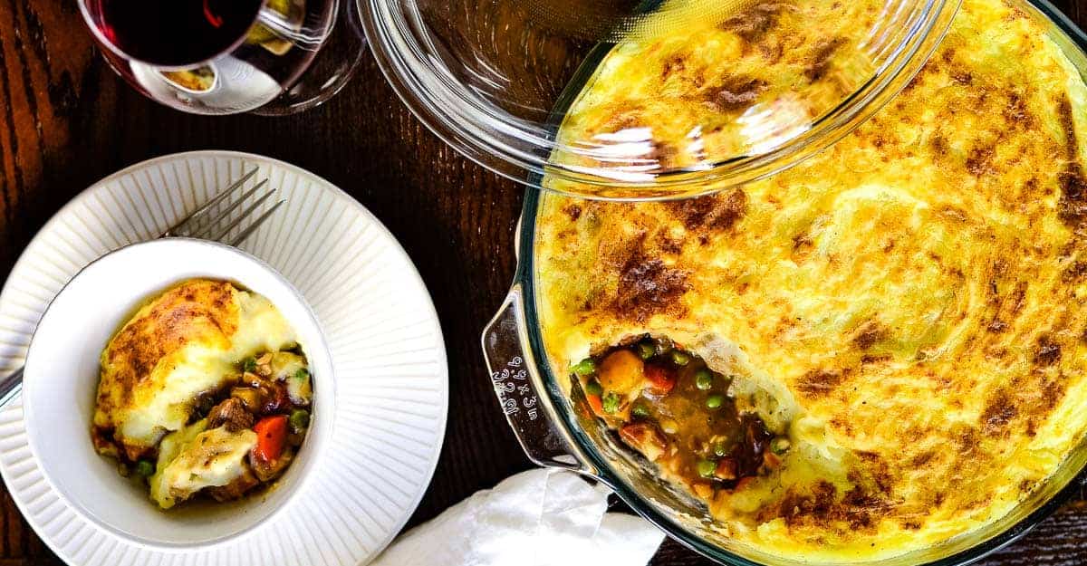 A lamb shepherd's pie served in a glass dish.