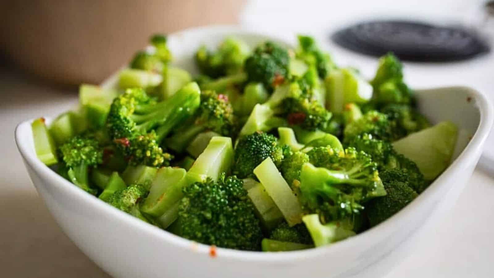 A bowl of broccoli in a white bowl.