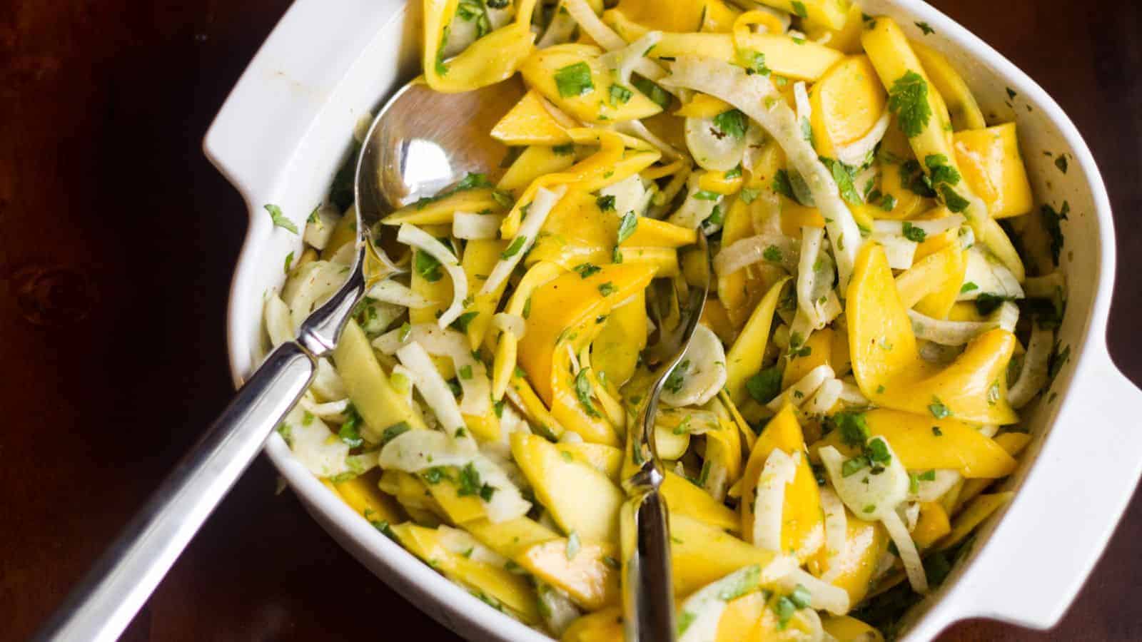 Overhead of fennel mango slaw in bowl.