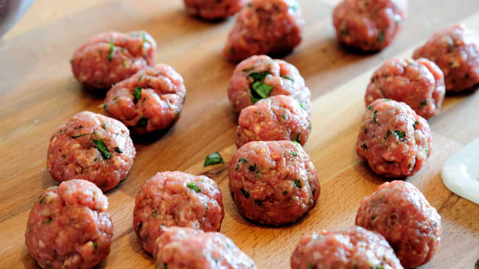 Close-up of pieces of uncooked meatballs