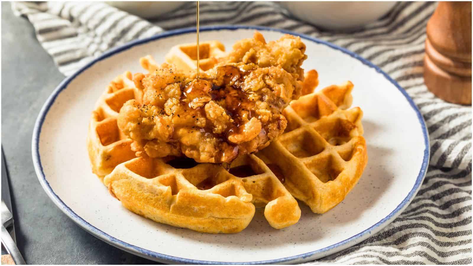 Chicken and waffles on top of a white plate